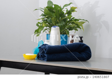 Spa Products Set Rolled Towels, Organic Soap and Essential bottles with shampoo for washing body and hair in bathroom. Washcloth, lotion and Shower gel. Spa Products Set Rolled Towels, Organic Soap and Essential bottles with shampoo for washing body and hair in bathroom. Washcloth, lotion and Shower gel. 140651807