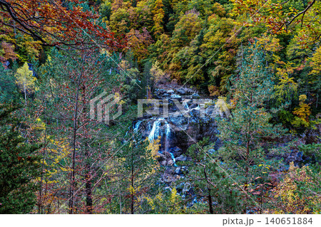 Waterfall on the Hunter's Trail in autumn. Ordesa and Monte Perdido Natural Park, Pyrenees, Spain Waterfall on the Hunter's Trail in autumn. Ordesa and Monte Perdido Natural Park, Pyrenees, Spain 140651884