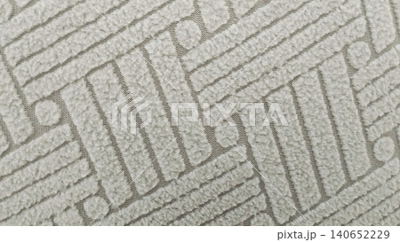 Light beige upholstery fabric texture background with geometric pattern. Light beige upholstery fabric texture background with geometric pattern. 140652229