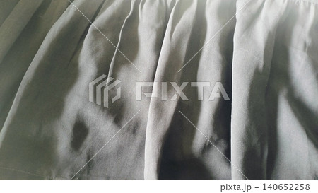 Close-up of dark black textile surface, elegant drapery material backdrop. Close-up of dark black textile surface, elegant drapery material backdrop. 140652258