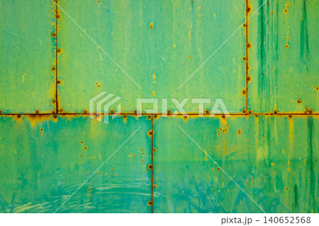 Weathered Green Metal Panel with Rust and Rivets Weathered Green Metal Panel with Rust and Rivets 140652568