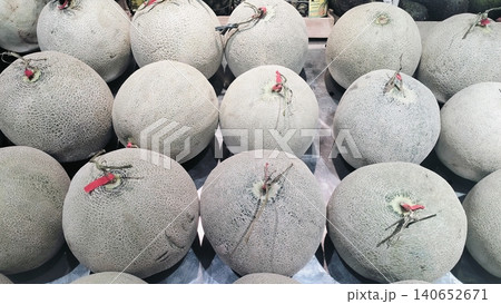 Fresh whole cantaloupe muskmelons background on display at market. Fresh whole cantaloupe muskmelons background on display at market. 140652671