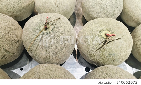 Fresh whole cantaloupe muskmelons background on display at market. Fresh whole cantaloupe muskmelons background on display at market. 140652672