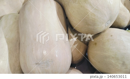 Pile of organic whole butternut pumpkins at local grocery store Pile of organic whole butternut pumpkins at local grocery store 140653011