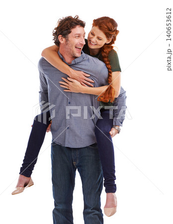 Piggy back, love and smile with couple, happiness and relationship isolated on a white studio background. People, man carrying woman and romance with marriage and bonding together with date and joy Piggy back, love and smile with couple, happiness and relationship isolated on a white studio background. People, man carrying woman and romance with marriage and bonding together with date and joy 140653612