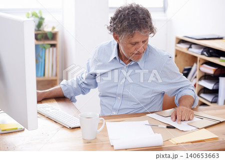 Man, documents and notes in office for resume, paperwork or report in morning for review and read with computer. Businessman with stationery and folder or file for info or results for scan with tech Man, documents and notes in office for resume, paperwork or report in morning for review and read with computer. Businessman with stationery and folder or file for info or results for scan with tech 140653663