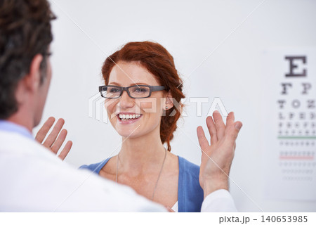 Man, optician and patient with glasses for eye test consultation for vision, retina or examination. Male person, woman and eyewear conversation for wellness checkup or advice, prescription or care 140653985