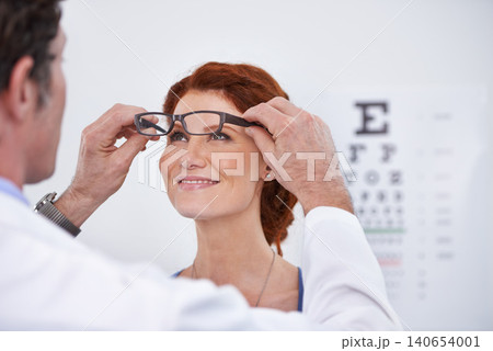 Man, optician and patient with glasses for eye exam consultation or healthy vision, retina or testing. Male person, woman and eyewear conversation for wellness checkup or advice, prescription or care Man, optician and patient with glasses for eye exam consultation or healthy vision, retina or testing. Male person, woman and eyewear conversation for wellness checkup or advice, prescription or care 140654001