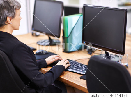Business woman, computer and typing in an office with email, blank monitor and internet at company. Desktop, professional and female person with technology of website manager at a desk with worker 140654151