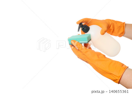 process of applying detergent from a dispenser bottle onto a green sponge in gloved hands process of applying detergent from a dispenser bottle onto a green sponge in gloved hands 140655361
