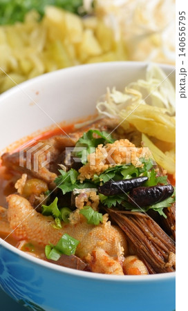 rice vermicelli with northern thai curry sauce on blue background 140656795