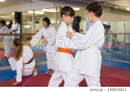 Kids sparring during karate training 140658621