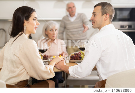 Elderly parents do not approve of tender relationship between adult son and his girlfriend Elderly parents do not approve of tender relationship between adult son and his girlfriend 140658890