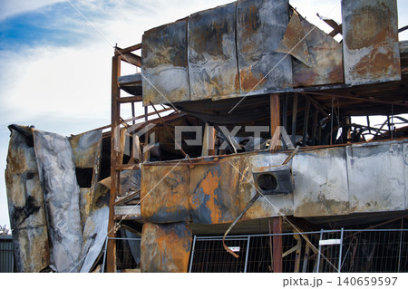 Exterior view of a severely damaged building after a devastating fire incident Exterior view of a severely damaged building after a devastating fire incident 140659597