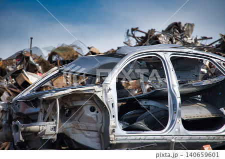 Scrap Metal Car Frame In Auto Junkyard Pile With Crushed Vehicle For Recycling And Salvage Scrap Metal Car Frame In Auto Junkyard Pile With Crushed Vehicle For Recycling And Salvage 140659601