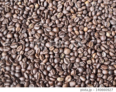 Macro shot of roasted dark roast Robusta coffee beans texture 140660927