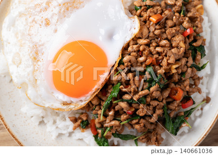 Thai food, Stir-fried holy basil with minced pork with cooked rice and fried egg on top, Top view 140661036