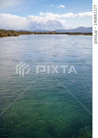 Patagonia river landscape with mountain and blue sky 140661177