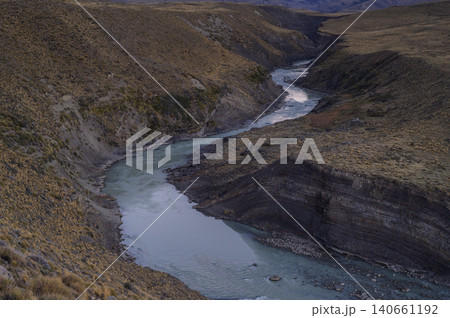 Patagonia river canyon landscape with rugged hillside and winding water Patagonia river canyon landscape with rugged hillside and winding water 140661192