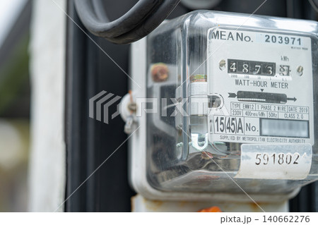 Electric measuring power meter for energy cost at home and office. 140662276