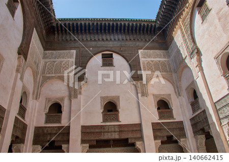 Architectural view of the historic courtyard at the Al-Attarine Madrasa with Moorish arches in Fez, Morocco 140662415