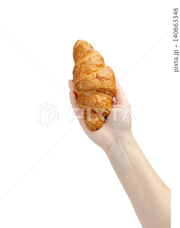 Woman holding a fresh croissant on the white background Woman holding a fresh croissant on the white background 140663346