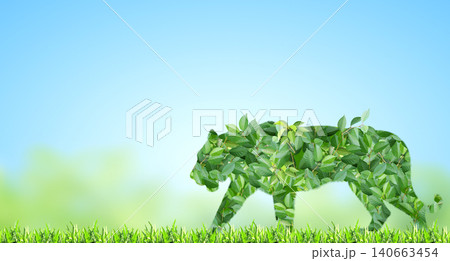 Tiger silhouette made of green leaves on sunny background. Ecology, global ecological resource, go green concept. Environmental conservation, wildlife protection, Eco-friendly, Green Energy Tiger silhouette made of green leaves on sunny background. Ecology, global ecological resource, go green concept. Environmental conservation, wildlife protection, Eco-friendly, Green Energy 140663454