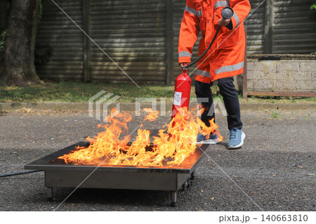 fire prevention. corporate safety - exercise during a firefighting course fire prevention. corporate safety - exercise during a firefighting course 140663810