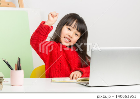 Intelligent Chinese girl doing homework at desk, thinking deeply and having a great idea or eureka moment. Intelligent Chinese girl doing homework at desk, thinking deeply and having a great idea or eureka moment. 140663953