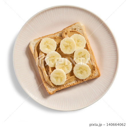 Peanut Butter and Banana Toast on Plate Isolated on White Background, Top View Peanut Butter and Banana Toast on Plate Isolated on White Background, Top View 140664062