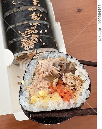 Delicious kimbap rolls filled with fresh vegetables, seasoned rice, and savory proteins, all wrapped in crisp seaweed. A perfect combination of flavor and texture in every bite. Delicious kimbap rolls filled with fresh vegetables, seasoned rice, and savory proteins, all wrapped in crisp seaweed. A perfect combination of flavor and texture in every bite. 140664568