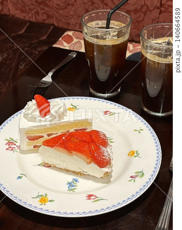 Light and creamy desserts with delicate layers, fresh fruits, and rich flavors, paired with refreshing sweet drinks. A perfect café treat for a delightful and indulgent experience. 140664589