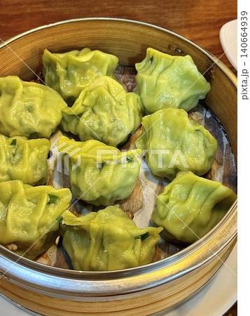 Korean dumplings filled with a mix of savory ingredients like ground meat, tofu, and vegetables. Mandu can be steamed, boiled, or pan-fried, making it a versatile and delicious snack or meal. Korean dumplings filled with a mix of savory ingredients like ground meat, tofu, and vegetables. Mandu can be steamed, boiled, or pan-fried, making it a versatile and delicious snack or meal. 140664939