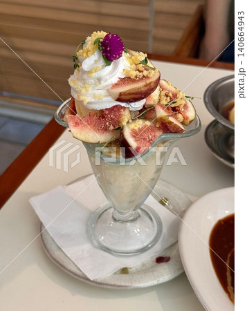 Smooth and creamy parfait layered with fresh fig slices, velvety yogurt, and crunchy granola. A perfect blend of natural sweetness, rich texture, and wholesome flavors for a refreshing dessert. Smooth and creamy parfait layered with fresh fig slices, velvety yogurt, and crunchy granola. A perfect blend of natural sweetness, rich texture, and wholesome flavors for a refreshing dessert. 140664943