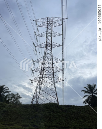 High Voltage Transmission Tower On Tropical Hill In Malaysia High Voltage Transmission Tower On Tropical Hill In Malaysia 140665033