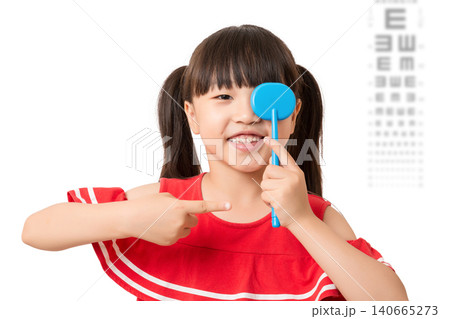 Asian little girl eye test, covering one eye, vision examination, child healthcare, ophthalmology concept 140665273
