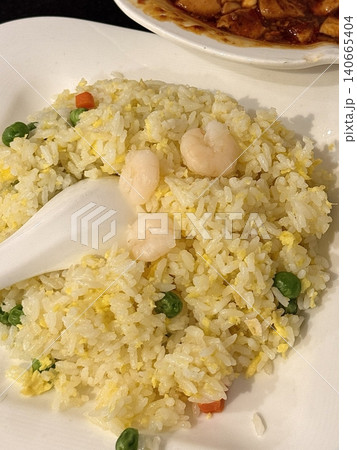 nasi goreng or fried rice traditional frying rice dish from indonesia made of Precooked rice fried in a small amount of oil, then spiced up with shallots, garlic, chili and sweet soy sauce. nasi goreng or fried rice traditional frying rice dish from indonesia made of Precooked rice fried in a small amount of oil, then spiced up with shallots, garlic, chili and sweet soy sauce. 140665404