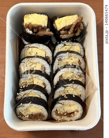 Delicious kimbap rolls filled with fresh vegetables, seasoned rice, and savory proteins, all wrapped in crisp seaweed. A perfect combination of flavor and texture in every bite. 140665474