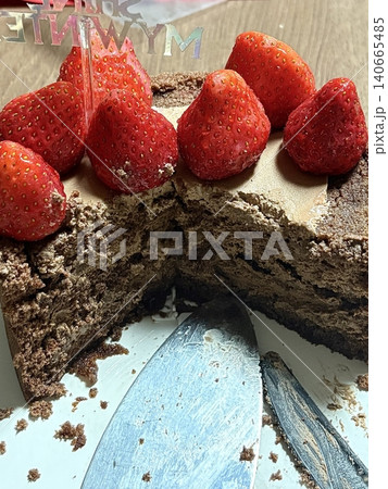Strawberry cake with soft fluffy layers, topped with fresh strawberries and smooth cream, showcasing vibrant red fruit, delicate textures, and sweet inviting appearance in close-up detail Strawberry cake with soft fluffy layers, topped with fresh strawberries and smooth cream, showcasing vibrant red fruit, delicate textures, and sweet inviting appearance in close-up detail 140665485