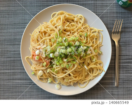 Creamy spaghetti carbonara made with rich egg yolk sauce, crispy bacon, parmesan cheese, and freshly ground black pepper for a classic, indulgent Italian pasta dish. 140665549