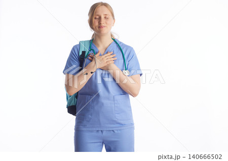 Peaceful Nursing Student with Hands Over Heart 140666502