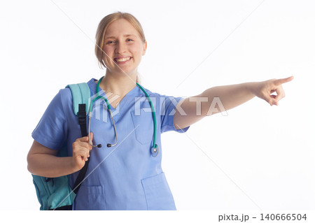 Confident Nursing Student Pointing Sideways Confident Nursing Student Pointing Sideways 140666504