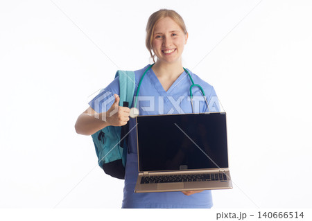 Healthcare Student Giving Thumbs Up with Laptop for E-Learning Healthcare Student Giving Thumbs Up with Laptop for E-Learning 140666514