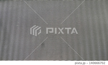 Close-up of textured EVA foam rubber surface, geometric wavy pattern. 140666702