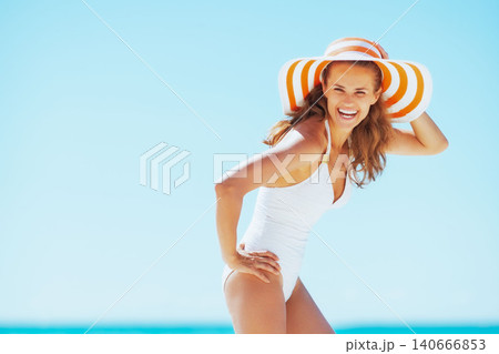 young woman in hat on beach young woman in hat on beach 140666853