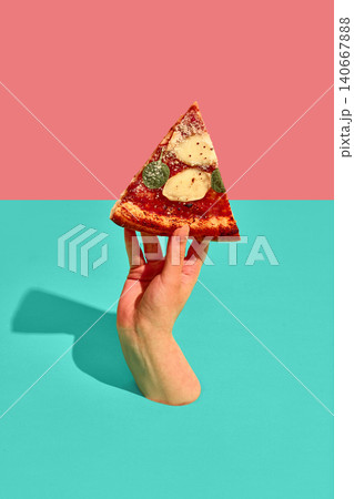Hand holding single Margherita pizza slice against colorful geometric background. Hand holding single Margherita pizza slice against colorful geometric background. 140667888
