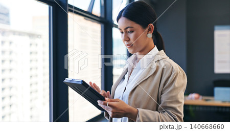 Window, tablet and business with woman, typing and internet with digital app and technology. Person, modern office and employee with website information and corporate with professional and research 140668660