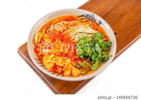 Nutritious mung bean noodles in a rich tomato and egg soup, garnished with fresh cilantro Nutritious mung bean noodles in a rich tomato and egg soup, garnished with fresh cilantro 140668736