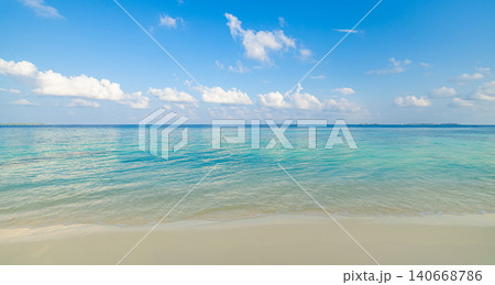 Bright tropical beach turquoise blue sky clouds. Minimal pristine shore calm summer shallows. Serene paradise horizon clean backdrop, peaceful exotic coastal escape Bright tropical beach turquoise blue sky clouds. Minimal pristine shore calm summer shallows. Serene paradise horizon clean backdrop, peaceful exotic coastal escape 140668786