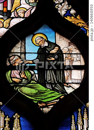 Saint Vincent de Paul, stained glass window in Saint Severin church in Paris, France 140668950